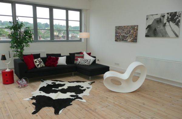 Two tiered Componibili side table in red foes along well with the throw pillows