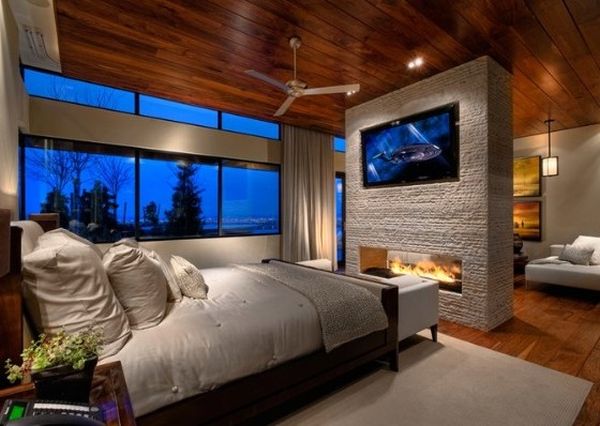 Wall mounted TV placed elegantly above the stylish fireplace