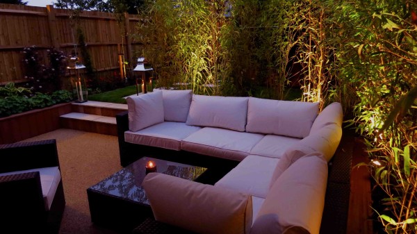 garden lounge with lighting below plants