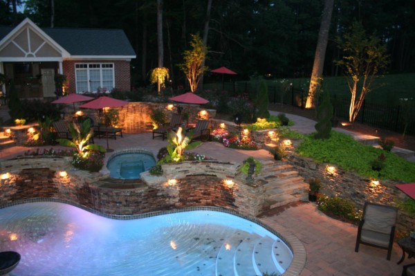 highlighted flower beds and pool