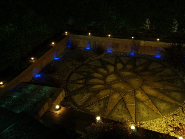 floodlight accentuates stone pattern in garden