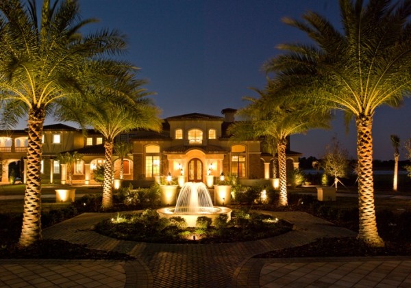 fountain and palm lighting in large garden setting