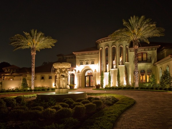 water fountain with lit palms