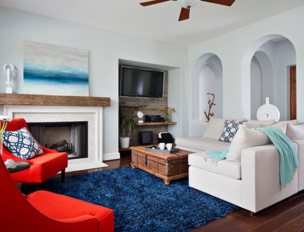 Art work above the fireplace accentuates the coastal look