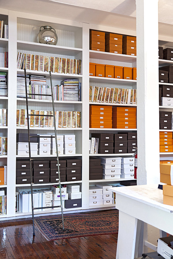 Boxes and binders in a beautifully organized office space