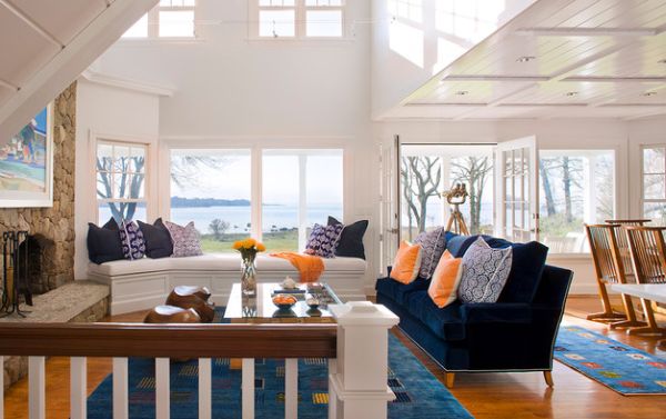 Coastal living room with bright pops of orange