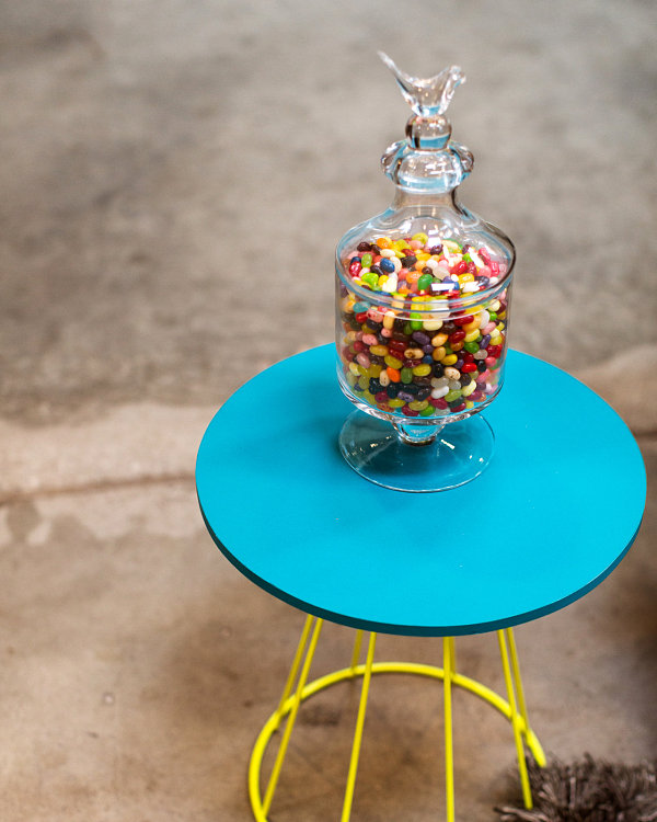 Colorful jelly beans on a blue and yellow table