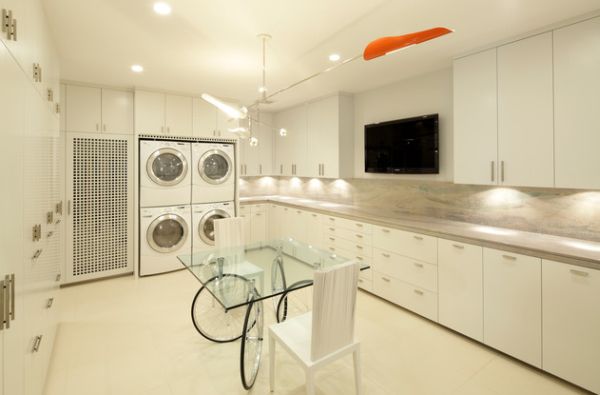 Contemporary laundry room comes with entertainment options as well!