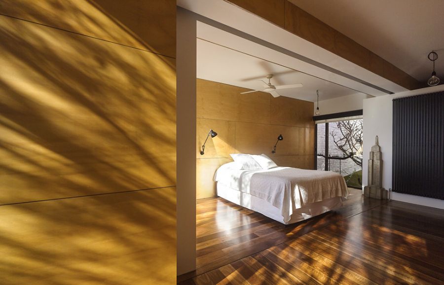 Elegant bedroomw with wooden flooring