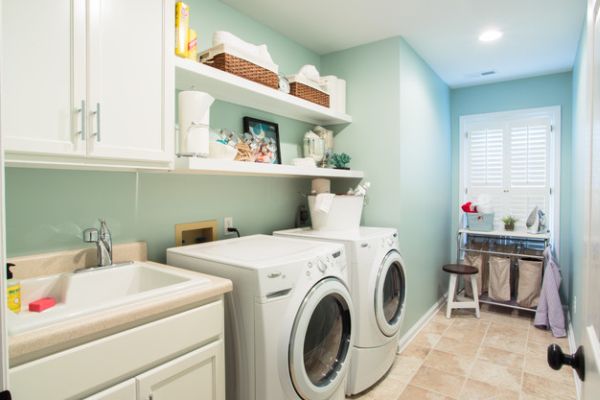 Ergonomic laundry room design with beautiful white shelves