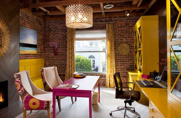 Exposed brick walls and fabric chairs create an inimitable work area