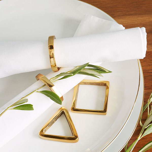 Geometric gold napkin rigs