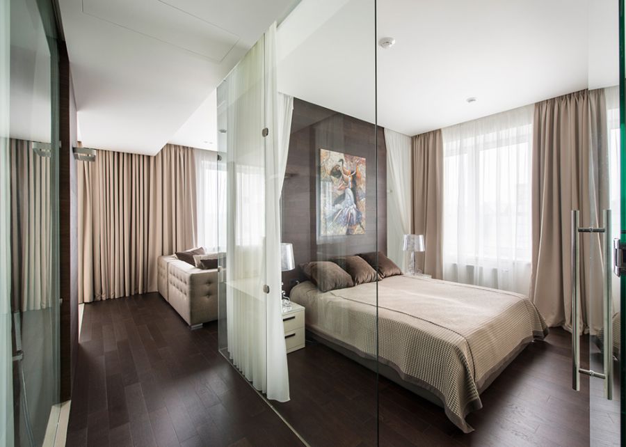 Glass doors lead into the bedroom