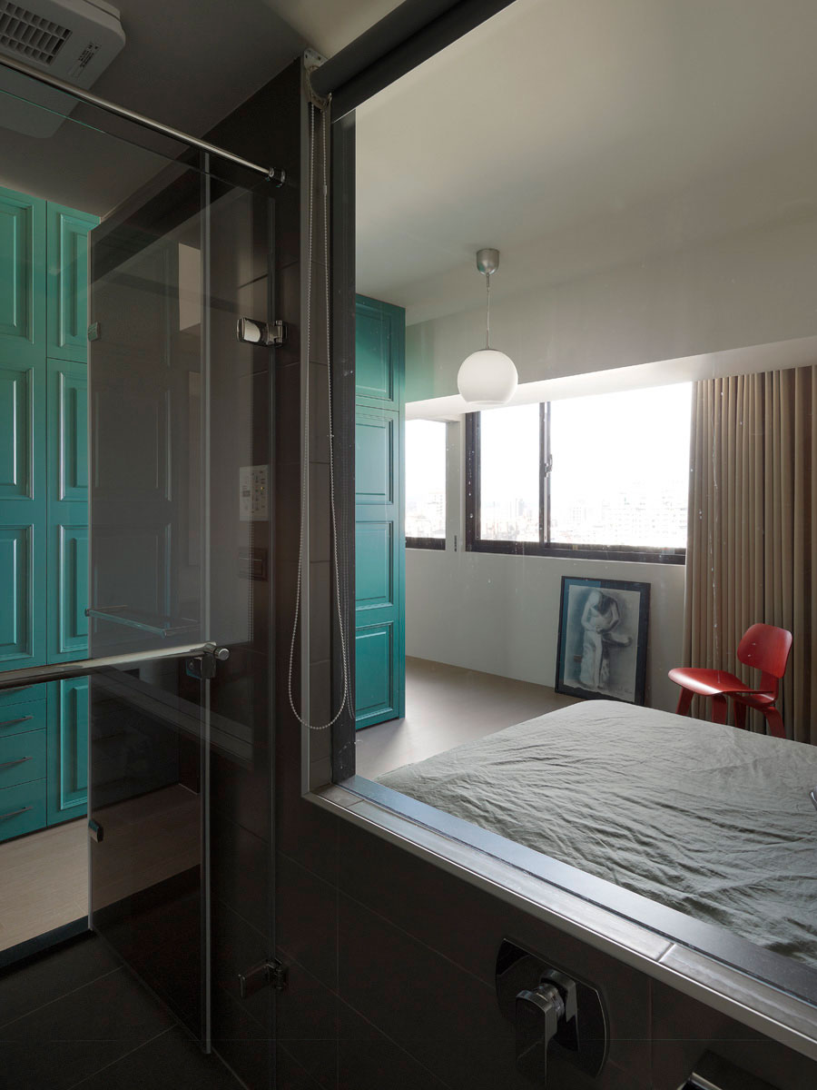 Glass shower area next to the bedroom