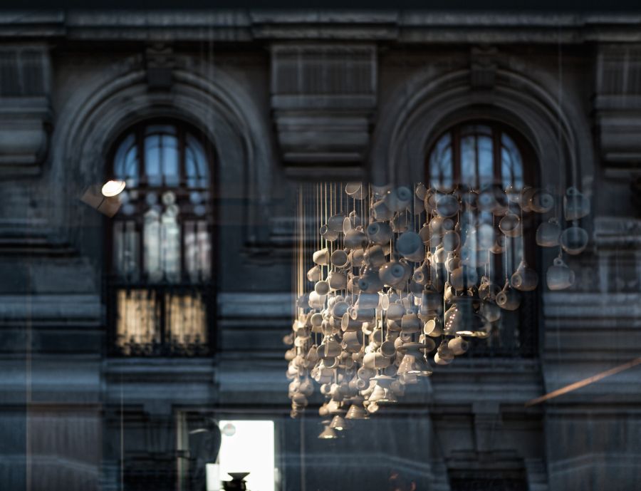 Hanging white cups appear like a cool floating cloud