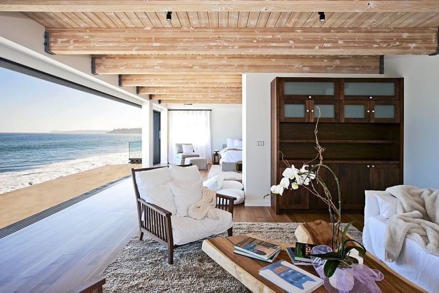 Large glass window offers ocean views