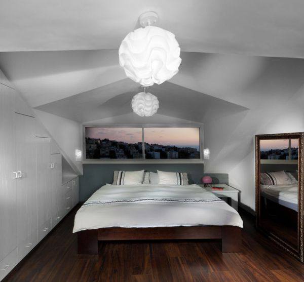 Mirror and  the window above the bed create a sense or spaciousness