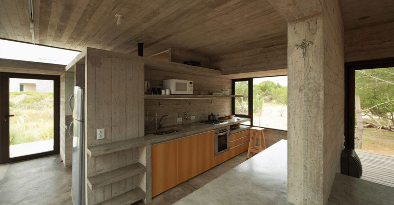 Modern kitchen in concrete and wood