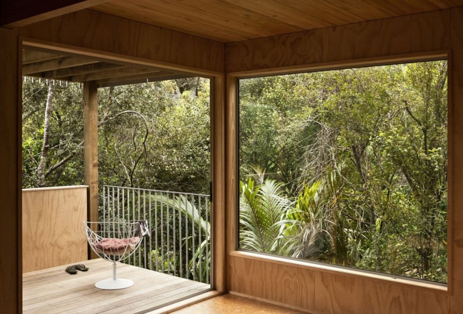 Open interior and large windows of the New Zealand home