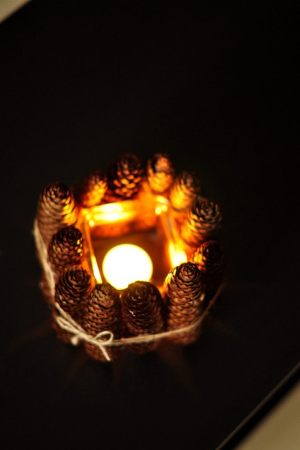 Pine cone and glass candle holder