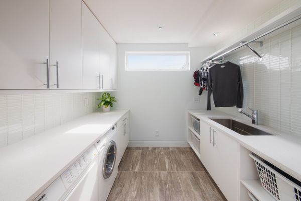 Sleek and stylish all-white contemporary laundry room!