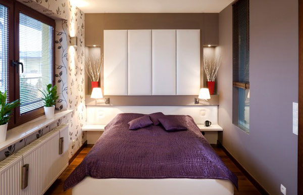 Smart lighting and sleek shelves create a refined bedroom