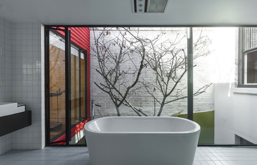 Stylish modern white bathroom with a view