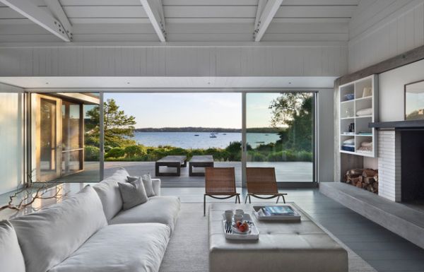 Wicker chairs and plush white sectional sofa anchor the coastal look