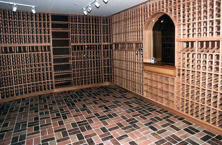 wine cellar in Petaluma California with earthtone tile floor and mirrored niche