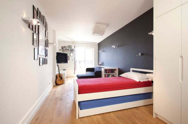 Accent wall adds color to the teen bedroom without visual fragmentation of space