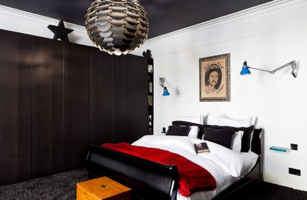 Bedroom with a black and white color scheme along with a dash of red