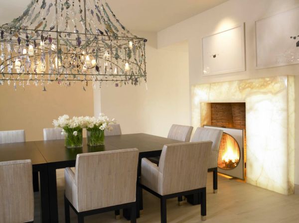 Brilliant dining room with fireplace lit from behind its quartzite slab