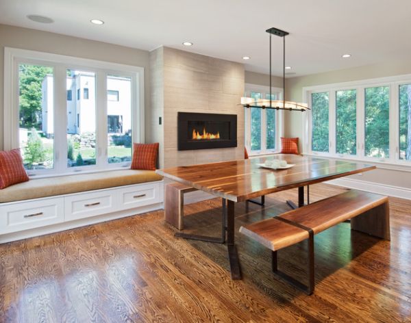 Central fireplace wall anchors the airy dining room beautifully