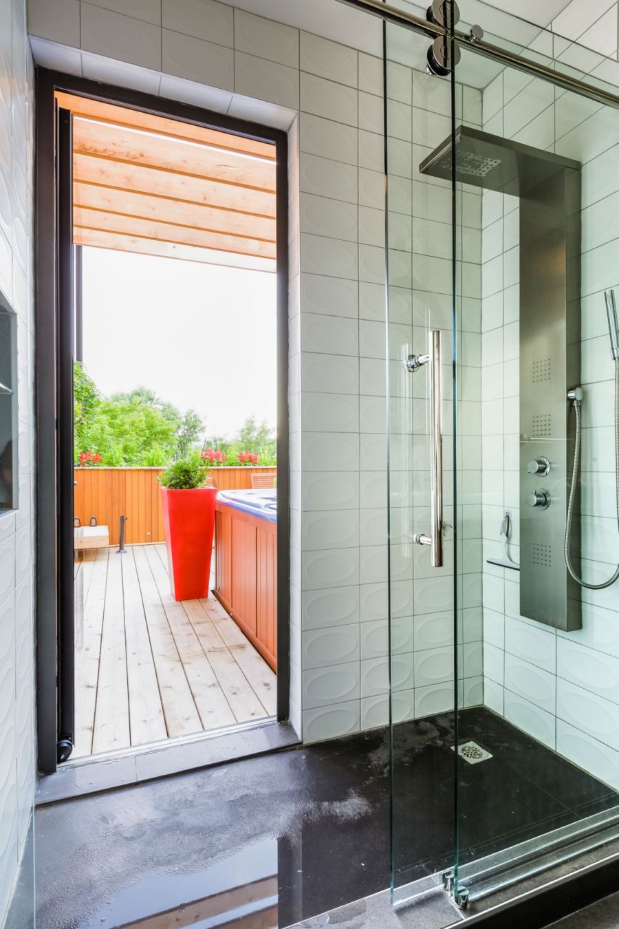 Contemporary bathroom opening up into the terrace with Jacuzzi