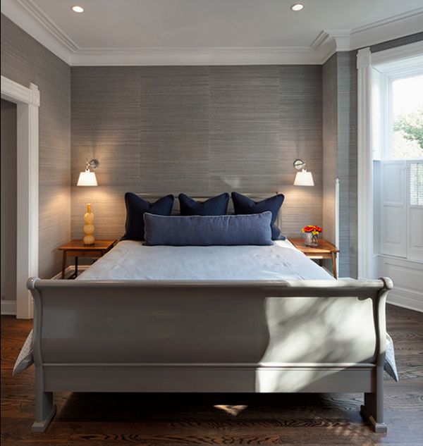 Contemporary bedroom in grey with a stylish sleigh bed