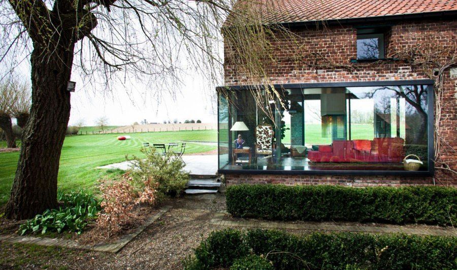 Contemporary glass addition to the old farmhouse