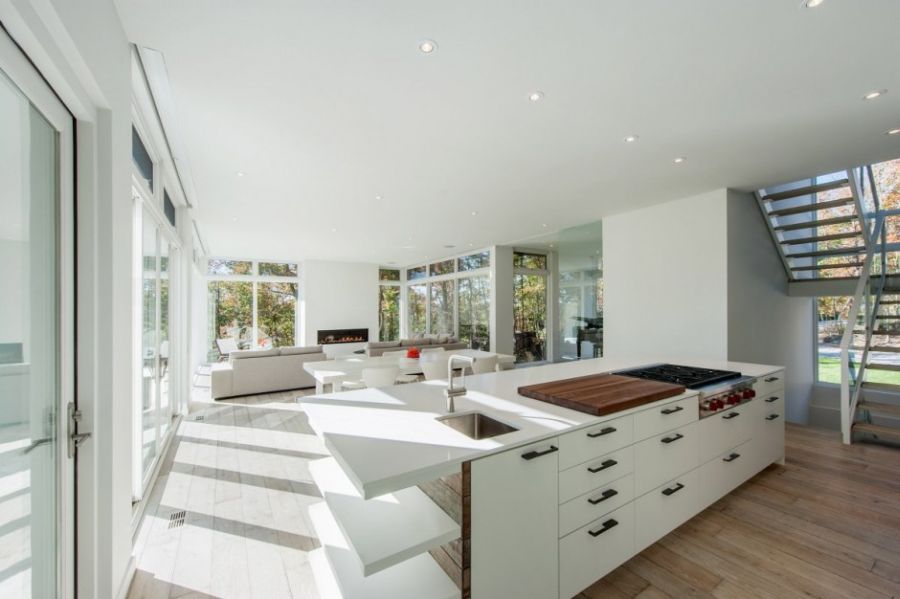 Contemporary kitchen island in white with shelves