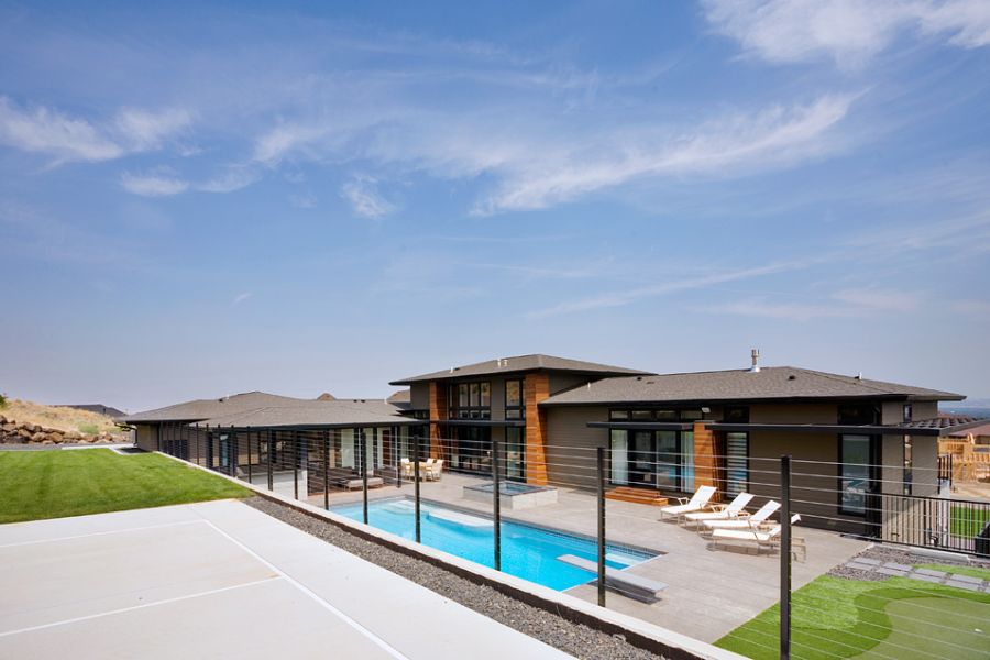 Contemporary patio with a refreshing pool