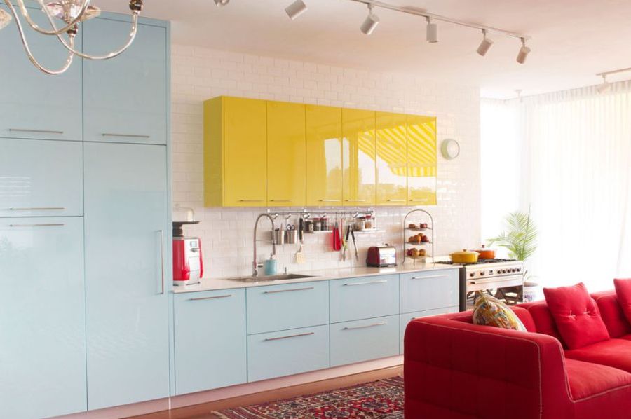 Cool blue and mellow yellow cabinets in the kitchen