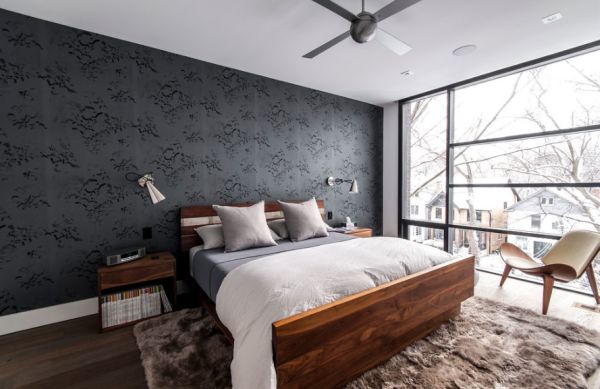 Dark and minimalist bedroom with stylish wall-mounted sconces