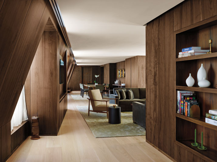 Dark walnut wall paneling inside the suites