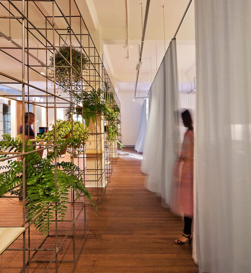 Drapes and green wall inside beauty salon