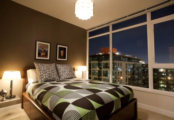 Eclectic bachelor pad bedroom in Vancouver with a view of the city skyline