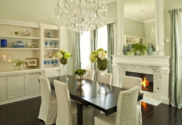 Eclectic dining room with a fireplace and a built-in mirror above it