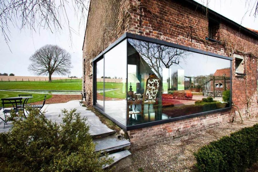 Glass box-in-box style installation to the old farmhouse