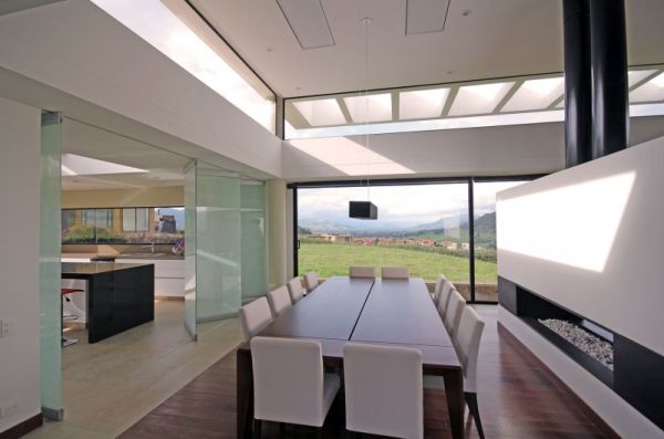 Grand dining room with a modern fireplace and a great view