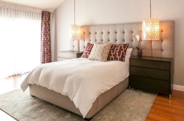 High-end hotel styled bedroom with an oversized tufted headboard