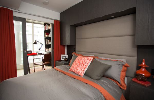 Hints of orange and red spice up the beautiful bedroom