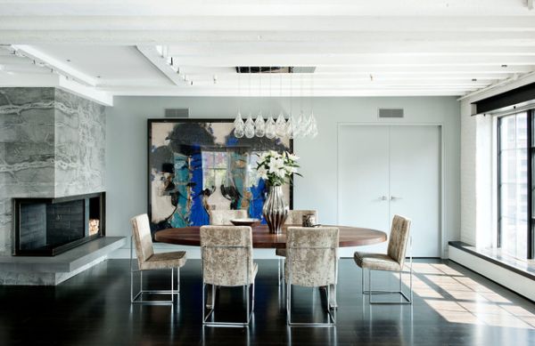 Industrial style dining room with marble slab and blackened steel fireplace