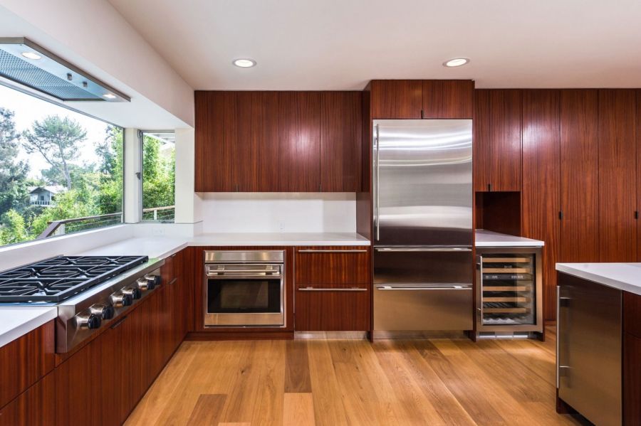 Kitchen with wood cabinets and stylish design